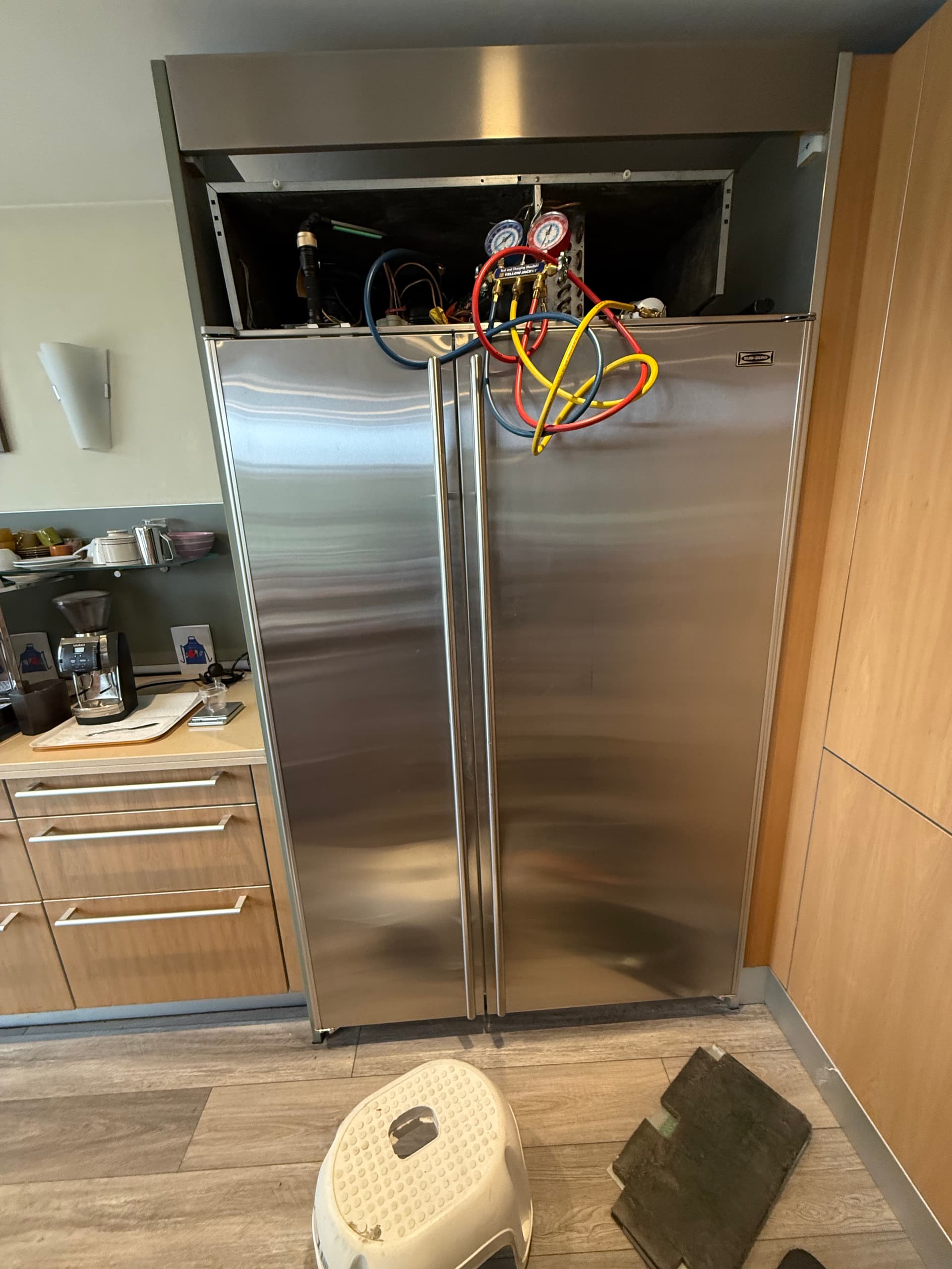 OPUS technician repairing a refrigerator in San Diego